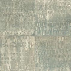 an area rug that has been made with different colors and patterns on the surface, including gray