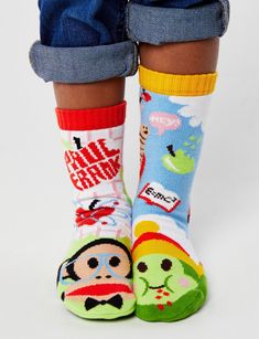 Introduce your cool kid to the wonderful world of Paul Frank!™ Straight outta your nostalgic y2k fashion, dELiA*s catalog dreams, geek themed Julius the iconic monkey & Sam the (bookworm) grub. These fun and colorful socks are part of the Pals + Paul Frank™ limited edition Collection. Both kids sizes have non-slip silicon grips on the bottom to prevent slipping. Pals are an easy conversation starter, a socio-emotional learning opp. They are visual proof that it is so so much more fun that these Casual Multicolor Cartoon Print Socks, Fun Non-slip Socks For Playtime, Fun Multicolor Character Print Socks, Fun Round Toe Socks For Playtime, Multicolor Casual School Socks, Casual Multicolor Character Print Socks, Casual Multicolor School Socks, Julius The Monkey, The Bookworm