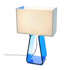 a blue table lamp with a white light on it's side and a square shade