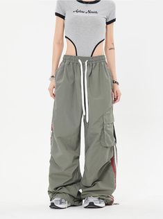 Our Striped Wide Leg Track Pants combine classic style with a relaxed fit for effortless comfort. Made with an elastic drawstring waistband and a striped pattern, these pants are perfect for weekend lounging at home or a casual day out. Model is 5'2 100lbs wearing M