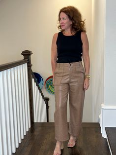 The classic style of a cropped wide leg pant, in a soft supple vegan leather. Go from day to night styling effortlessly. Elevated chic. 100% polyurethane Dry clean only or wipe with damp cloth Cathleen is 5'4" wearing a small Wide Leg Faux Leather Work Pants, Chic Wide Leg Leather Pants For Business Casual, Casual Brown Leather Workwear Pants, Casual Brown Leather Pants For Work, Casual Leather Pants For Work, Wide Leg Faux Leather Pants For Work, Chic Wide Leg Leather Pants, Casual Brown Wide Leg Leather Pants, Brown Leather Pants For Spring Workwear