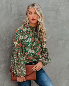 Relaxed Fit Self & Lining¨C100% Polyester Hand Wash Cold. Dry Flat Smocked Neckline Long Billowy Sleeves Back Keyhole with Neckline Button Closure Lined Body Only¨C Sleeves are Unlined We're loving all of the fall florals this season! Our Evander Floral Balloon Sleeve Blouse is green with rust. salmon. and cream florals throughout. The mock neckline and billowed sleeves give this top a unique touch. Styled with the Perfect Hoop Earrings. Stella Crossbody Envelope Zip Clutch. Tilley Frayed An Off Shoulder Evening Gown, Floral Balloons, Floral Chiffon Blouse, Fall Florals, Balloon Sleeve Blouse, Mini Skater Dress, High Neck Long Sleeve, Mock Neckline, Outfits Winter