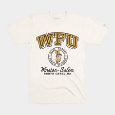 Calling back to vintage, mid-20th century Wake Forest pennants, we adapted this retro block “WFU” to design something with that era in mind. The addition of their location in Winston-Salem is a nod to Wake Forest’s midcentury move in 1946, along with this retro-inspired crest. Products are mocked up on a size S. Graphics may appear smaller on larger sizes. Vintage White T-shirt For Fan Gear, Vintage White Tops With Embroidered Graphics, Vintage College T-shirt With Lettering, Vintage Embroidered College Top, Vintage Embroidered Graphics Top, Vintage Embroidered Graphic Top For College, Vintage Embroidered Tops For College, Vintage T-shirt With Lettering For College, Vintage Screen Print Fan Gear Tops