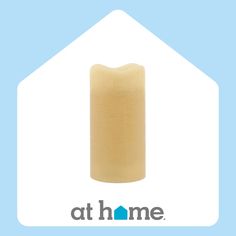 an image of a candle that is in the shape of a house with the words at home on it