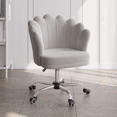 a white office chair sitting on top of a hard wood floor next to a book shelf