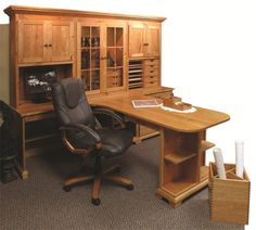 an office desk with a chair and wooden cabinet in the corner on carpeted flooring