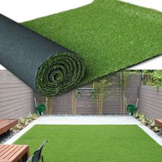 an artificial grass mat is laying on the ground next to a wooden bench and table