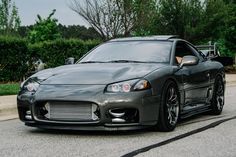 a black sports car parked on the street