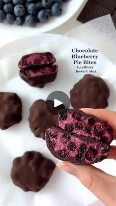 chocolate blueberry pie bites on a white plate