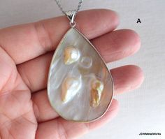 This sterling silver blister shell pendant necklace is so stunning in its simplicity. Perfect for someone who loves an attention-getting piece that truly makes a statement. A teardrop blister shell encased in sterling silver hangs off a sturdy 24 inch stainless steel cable chain. The pendant measures ~ 2.5 inches in height (including the bail) and is 1.5 inches wide. There are two versions currently available. Select your preferred pendant from the pull down variation menu. Convo me for a differ Teardrop High Luster Necklace As A Gift, Teardrop High Luster Necklace Gift, Teardrop Pendant Jewelry With High Luster For Gifts, Perfume Making, Stainless Steel Cable, Necklace Statement, Chain Jewelry, Shell Pendant, Keep Jewelry