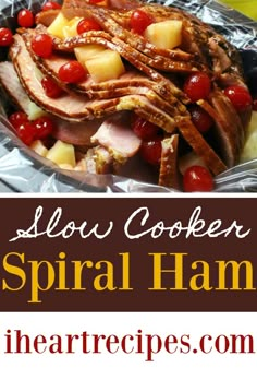 slow cooker spiral ham with pineapples and cherries on it in foil