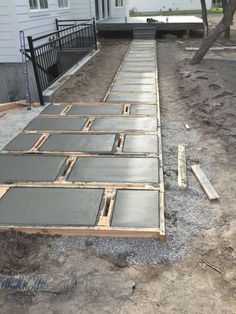 the concrete is laid out on the side of the house to be poured into the yard