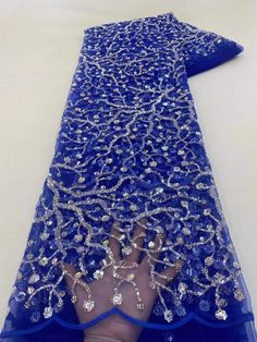 This high quality Fabric is measured in 5 Yards With Embroidered Beading and Sequin. It is soft, very delicate and beautiful. This high Quality Fabric is made with Fashion embroidered rhinestones can be used in making party wedding dresses, skirts, shawls, scarves and other other fashion apparels as you would like. Size : Length : 5 yards (180 inch). Width: 50 inch (Please allow slight deviation for the measurement data ,±1 inch) Material: 100% Polyester, Tulle Lace Fabric, Eco-Friendly embroide Blue Embellished Fitted Embroidered Fabric, Fitted Blue Embellished Embroidered Fabric, Party Lace Fabric With Pearl Embroidery, Elegant Embroidered Fabric With Rhinestones For Party, Party Lace Embroidered Fabric With Beads, Elegant Embroidered Fabric With Rhinestones For Wedding, Elegant Rhinestone Embroidered Fabric For Weddings, Party Embellished Organza Embroidered Fabric, Blue Embellished Embroidered Fabric For Wedding