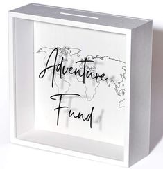 a white box with the words adventure fund written on it and a world map in black ink