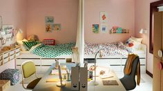 two children's bedroom with bunk beds and desks in the corner, one is pink