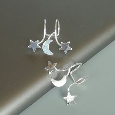 IMPORTANT **Please go through all the pictures i have posted for a listing with a ruler, on a model, on my hand, to get an exact idea of the actual size of the item.Sterling silver ear cuff and wrap earring.Comes with a crescent moon and stars. This listing is for ONE PAIR Size: 15 x 19 mm Stars: 5x 5mm Crescent moon: 6 x 5mm Weight: 0.90gm These earrings are made of real 925 hypoallergenic sterling silver. All my pieces are sent in a gift box. I can include a personal message from you if needed Silver Moon Shaped Cartilage Earrings, Celestial Silver Cartilage Earrings, Silver Moon Cartilage Earring, Silver Moon-shaped Single Cartilage Earring, Silver Star-shaped Ear Cuff As Gift, Silver Star-shaped Ear Cuff For Gift, Silver Star Shaped Ear Cuff Gift, Silver Star Shaped Ear Cuff As Gift, Celestial Silver Nickel-free Cartilage Earrings