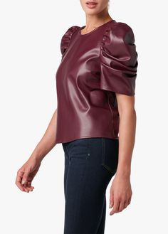 Of-the-moment puff shoulders add flare to the Kira short sleeve top. And since it's crafted from buttery soft, vegan leather--this top is sophisticated enough for the office and edgy enough for after hours. 100% PolyurethaneMODEL IS WEARING SIZE SMALL Edgy Tops, Leather Blouse, Faux Leather Top, Zinfandel, Sweater Collection, Womens Size Chart, Puff Sleeve Top, Colored Denim, Joes Jeans