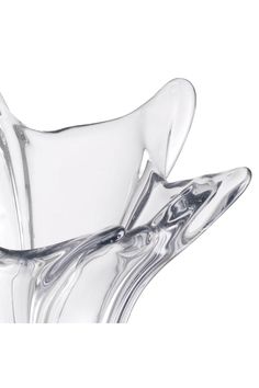 a clear glass vase sitting on top of a table