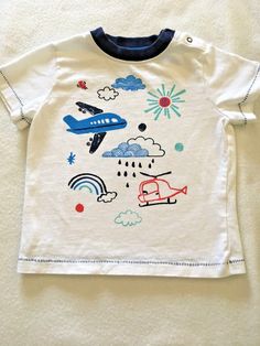 Gymboree Line: Spring Forward 2018- Pilot TEE Size: 18-24 Months Condition: Pre-Owned Excellent- No rips, stains, tears, fading!  Description: Features detailed Airplane/helicopter screen print. Shoulder snaps for EZ changing. Measurements: shoulder to bottom hem: 12" underarm to underarm: 10" My Home is Pet and Smoke FREE  I combine shipping on all orders- use the cart and ask for invoice at checkout. White Tops With Character Print For Playtime, White Character Print Tops For Playtime, Pilot Airplane, Airplane Pilot, Spring Forward, Screen Print, My Home, Screen Printing