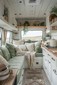 the interior of a camper with green and white decor