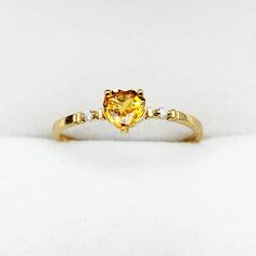 10K Yellow Gold Ring Heart Shape Yellow Sapphire 0.60ct Two Diamonds 0.02ct Made in Canada * Comes in a Beautiful Gift Box, Perfect for Gifting * This ring is available in white gold and several gemstone selections. Please message me if you need any further information. ------------------------------------------------ * Please click here to visit my shop: https://www.etsy.com/shop/bestjewelryset * To see more rings please check out the link below: https://www.etsy.com/shop/BestJewelrySet?section Gold Heart Ring With Accent Stones Fine Jewelry, Gold Heart Ring With Accent Stones For Promise, Gold Heart Cut Birthstone Ring With Center Stone, Gold Heart Cut Birthstone Ring For Promise, 14k Gold Heart Cut Birthstone Ring With Center Stone, Yellow Gold Heart Ring With Accent Stones For Promise, Yellow Gold Heart Cut Birthstone Ring, Yellow Birthstone Promise Ring, Gold Heart Cut Diamond Ring With Accent Stones