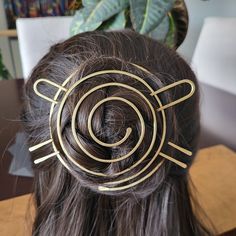 Large Hair Bun Holder with Fork Stick -handmade & unique -strong and sturdy -made of solid brass metal -fun spiral design    -works as a nice cover for a bun to dress it up -this bun cover comes with a strong fork to secure your bun. -Please note: Everyone's hair is different. Although this bun cover pin holds in the model's hair very well you may have to secure your bun with smaller bobby pins then add the bun cover as a decorative accessory. Size: 4 inches wide & tall Fork that goes through th Bun Holder, Hair Spirals Accessories, Hair Slides With Stick, Metal Hair Bun Cage, Hair Sticks Metal, Hair Accessories Bun, Spiral Design, Model Hair, Brass Metal