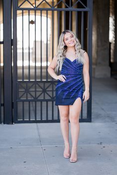 A model in a perfect dress for a night out or a homecoming dance! Featuring a dazzling sequin v-neckline and a strappy back, you'll be sure to sparkle all night. Glamorous Contrast Sequin Dress For Homecoming, V-neck Sequin Dress With Contrast Sequin For Prom, V-neck Mini Dress With Contrast Sequin For Prom, V-neck Sequin Dress For Prom Season, V-neck Sequin Dress For Prom Season Night Out, Homecoming V-neck Sequin Dress, V-neck Sequin Dress With Contrast Details For Homecoming, V-neck Sequin Dress With Contrast Sequin For Homecoming, Glitter Sequin Dress For Prom Cocktail