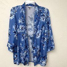 This A Tie Front Kimono By Allison Daley. This Kimono Is Brand New With Tags. The Style Is Called "Indigo Orchid" And It Features A Lovely Orchid Floral Print. Brand New With Tags. Size: Small/Medium Chest, Measured Flat From Armpit To Armpit: 19.5 Inches Length, Measured From Shoulder To Hem: 26 Inches Fabric: 100% Rayon. A-0282 Spring Floral Print Outerwear For Loungewear, Fitted Blue Outerwear For Loungewear, Blue Outerwear For Spring Loungewear, Blue Floral Print Summer Outerwear, Summer Blue Floral Print Outerwear, Summer Daywear Blue Outerwear, Summer Blue Outerwear For Daywear, Jean Jacket Vest, Purple Sweatshirt