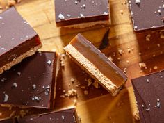 several pieces of chocolate on a wooden cutting board