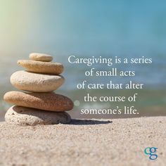 a stack of rocks sitting on top of a beach next to the ocean with a quote about caregiving is a series of small acts of care that alters