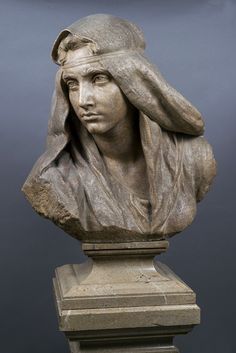 a statue of a woman wearing a headdress