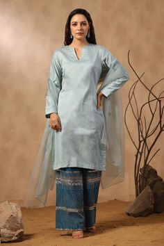 Sky blue straight chanderi kurta. Comes with dark blue hand embroidered chanderi pant and butti embroidered dupatta.
Components: 3
Pattern: Hand Embroidered
Type Of Work: Sequins, Pearls, Cutdana
Neckline: Notched
Sleeve Type: Full
Fabric: Kurta and Pant: Chanderi, Dupatta: Organza
Color: Blue
Other Details: 
Attached lining
Approximate product weight: 0.5-1 kg
Occasion: Puja - Aza Fashions Chanderi Dupatta, Pant For Women, Types Of Work, Embroidered Pants, Embroidered Dupatta, Blue Hand, Kurta Set, Aza Fashion, Sleeve Type