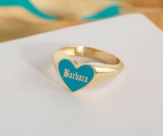 -----> 10K, 14K, 18K SOLID GOLD ENGRAVED ENAMEL HEART RING <------ The Ring Details: 💍Color of colored enamel coatings is optional. You may personalize your ring by choosing the color you want. 💍 You may personalize your ring by writing the name you want engraved on the ring in the personalization section. 💍 Please visit our listings for different types of this ring. 💍 10K-14K-18K Yellow, Rose, White Gold 💍 Band Gold Colour Options; Yellow Gold, White Gold, Rose Gold 💖 Discover the allure of personalized elegance with our latest heart-shaped gold ring. Crafted with precision and care, this enchanting piece offers a canvas for you to add your unique touch. 💛 Choose the enamel color that resonates with your style and emotion, transforming the heart into a vivid and personalized expres Word Ring, Name Ring, Engraved Ring, Name Rings, Personalized Ring, Gold Engraving, Custom Ring, Gold Colour, White Gold Band