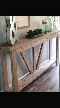 a wooden table sitting in the middle of a room