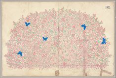 an old book with blue butterflies on the pages and pink flowers all over it, in front of a tree