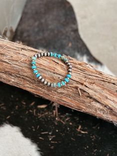 Turquoise Gemstone and Silver Bead Stretch Bracelet | Gussied Up Online Boutique Elevate your style with our Turquoise Gemstone Bead and Silver Stretch Bracelet. Adorned with 6mm turquoise gemstone and 6mm Navajo beads, this stretch bracelet is not only fashionable but also comfortable. Made with nickel, lead, and chrome-free materials, it's perfect for those with sensitive skin. Women's Western Wear, Western Wear For Women, Sterling Jewelry, Wedge Heel Sandals, Women's Wear, Silver Bead, Women's Boutique, Beaded Stretch Bracelet, Turquoise Gemstone