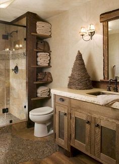 a bathroom with a sink, toilet and shower