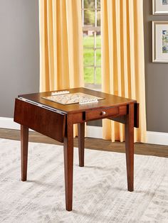 a wooden table sitting on top of a white rug