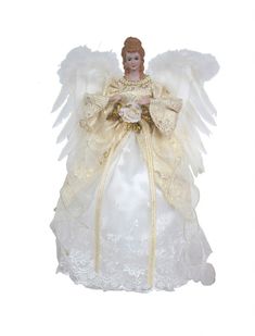 an angel doll is dressed in white and gold