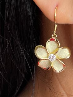 Beautiful Hawaiian 18mm Plumeria Flower With Cubic Zirconia Hook Dangle & Drop Earrings Solid Sterling Silver with a 925 Stamp Rhodium Finish Total Weight 4.1 grams Plumeria Width 18mm plumeria Length 18mm Drop Length 35mm Comes With Clear Silicone Earring Backs Amazing Gift For Friends and Family! Jewelry Gift Box Included! Flower Shaped Single Earring For Gift, Flower Shaped Single Earring Jewelry Gift, Gold Flower Single Earring Jewelry, Single Gold Flower Earring, Gold Flower-shaped Single Earring, Gold Flower-shaped Jewelry With Ear Wire, Gold Floral Jewelry With Ear Wire, Hypoallergenic Yellow Flower-shaped Jewelry, Gold Crystal Flower Shaped Earrings