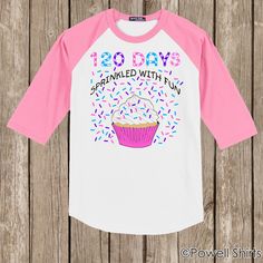 a pink and white shirt with a cupcake on it that says 100 days sprinkled with fun