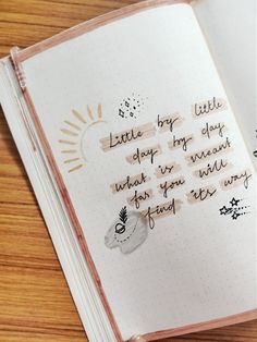 an open notebook with writing on it