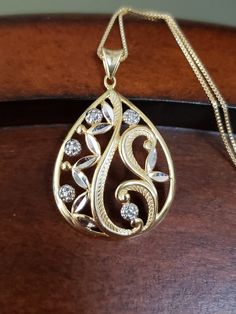 "Elegant & classic genuine Diamond pendant♥️ Gold layered over solid Sterling Silver in a TEARDROP shape, with diamond cuts, and set with a .01 point genuine Diamond at the top right (it looks like there are 4 other Diamond accents, but it is an illusion) . The pendant measures 1 3/8\" long including the bale, and 7/8\" across at the widest point Hallmarked 925 FAS THAI Weighs 4.6 grams Includes an 18\" Gold over Sterling Silver box chain *Brand New* Contact me with any questions" Gold Teardrop Pendant Jewelry With Diamond Cut, Gold Diamond Cut Teardrop Pendant Jewelry, Diamond Cut Teardrop Necklace For Anniversary, Gold Necklace With Diamond Accents And Teardrop Pendant, Gold Pear-shaped Necklace With Diamond Accents, Gold Diamond Cut Teardrop Pendant Necklace, Gold Drop Necklace With Diamond Cut, Gold Teardrop Drop Necklace For Anniversary, Gold Teardrop Pendant Drop Necklace With Diamond Accents