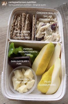 an open lunch box filled with different types of food and labeled in the words chicken walnut salad, apple slices, cranberry cheese, pecan