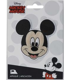 the mickey mouse patch is shown in white and black polka dot pattern with a smiling face