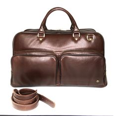 The leather travel bag is perfect for business or weekend trips. Suitable for men and women. Handmade, original design. Very light weight. Dimensions: * Height: 29 cm (11.42 inches) * Length: 50 cm (19.69 inches) * Width: 20 cm (7.87 inches) * Strap Drop length: max 130 cm (51.18 inches) Details: * One main part * Removable adjustable shoulder strap * Double leather handle * Two outside zipper pockets in the front of the bag * Zipper pocket inside * Two slip pockets inside Leather travel bag wit Cognac Travel Bag For Business, Business Weekender Bag In Cognac With Luggage Sleeve, Business Weekender Bag With Luggage Sleeve In Cognac, Brown Business Weekender Bag With Luggage Sleeve, Brown Satchel Duffle Bag For Business Trips, Luxury Brown Weekender Bag For Business, Brown Satchel Duffle Bag For Business, Brown Weekender Bag For Business Trips, Luxury Brown Briefcase For Overnight Trips