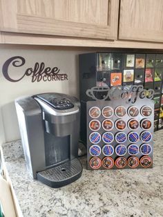 a coffee maker sitting on top of a kitchen counter next to a cup holder filled with cups