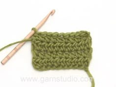 the crochet stitch is being worked on