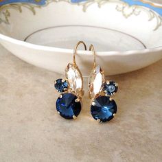 New!  Gorgeous earrings featuring Swarovski crystals in rich navy blue and champagne. Gold Sapphire Earrings For Wedding, Navy Blue And Champagne, Blue Bridal Jewelry, Something Blue Bridal, Bridal Earrings Drop, Blue Bridal, Earrings Flower, Flower Leaf, Ear Rings