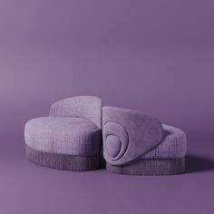 two purple couches sitting on top of each other